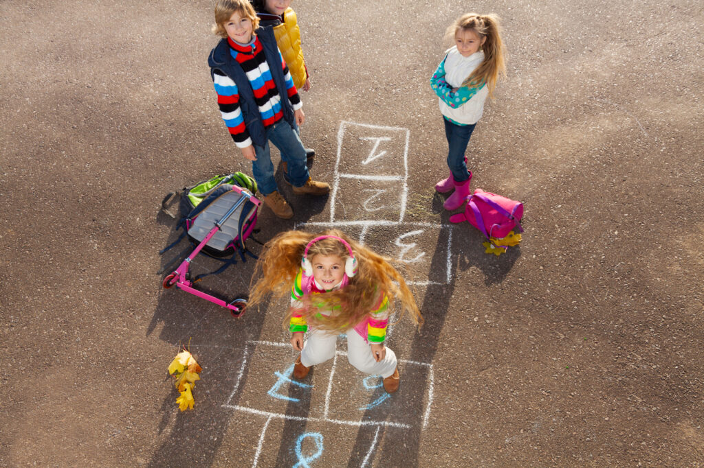 Children playing hopscotch - Kids Outside Adventures